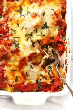 a casserole dish filled with meat and cheese