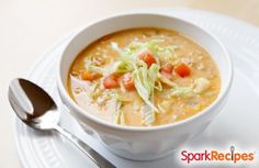 a white bowl filled with soup on top of a table