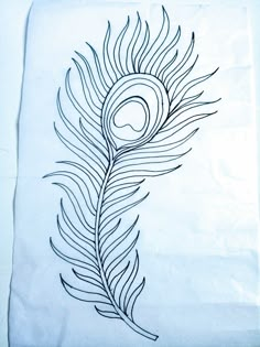 a piece of paper with a drawing of a peacock's tail on top of it