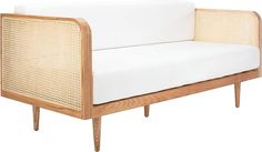 a white couch sitting on top of a wooden frame