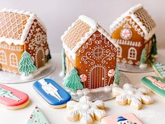 gingerbread houses decorated with icing and snowflakes