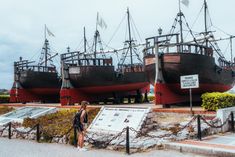 two large ships sitting next to each other on display