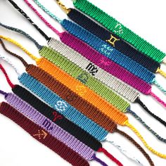 a group of colorful bracelets with numbers on them are laid out in a row