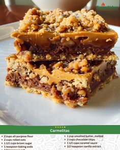 two pieces of granola bar sitting on top of a white plate