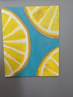 a painting of lemons on a blue and yellow background