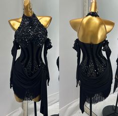 two mannequins dressed in black and gold with sequins on them