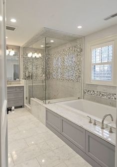 a large bathroom with a tub and walk in shower