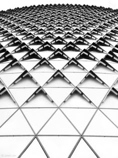 an abstract image of many triangles in black and white