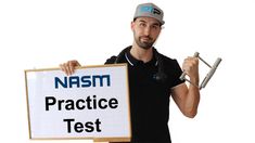 a man holding a sign that says namsm practice test