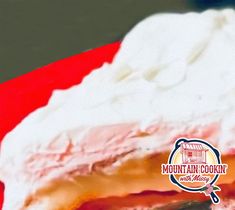 a close up of a cake on a red plate with the words mountain cookr next to it