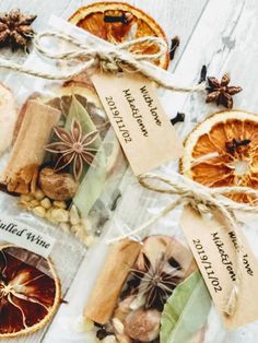 orange slices tied up with twine on top of each other next to cinnamon and star anise