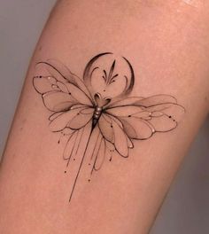 a small tattoo on the leg of a woman