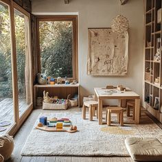 a child's playroom with wooden furniture and windows