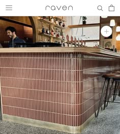 a man sitting at a bar in a restaurant