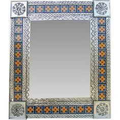 a decorative mirror with an orange and blue design on the bottom, in front of a white background