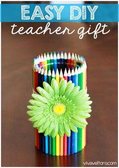 an easy diy teacher gift made out of colored pencils and a flower on top