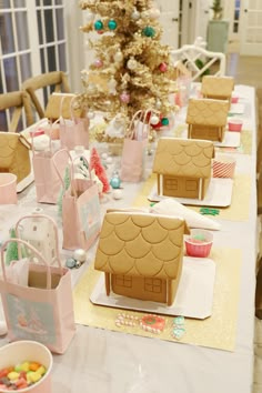 gingerbread houses are sitting on the table