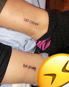 two people with tattoos on their arms and one has the word go crazy written on it