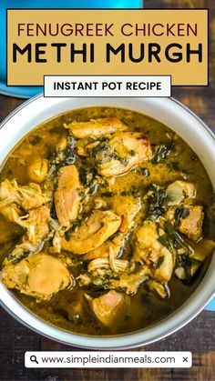 a white bowl filled with chicken and spinach soup on top of a wooden table