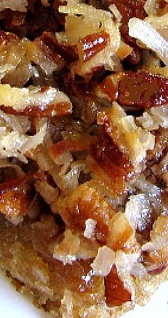 a close up of food on a white plate with raisins and other toppings