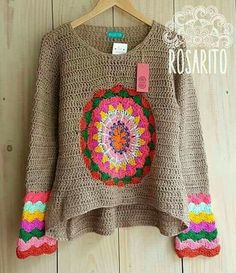 a brown sweater with colorful crochet on it