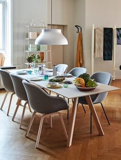 a dining room table with chairs around it