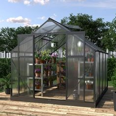 a small greenhouse with potted plants in it