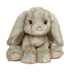 a small stuffed rabbit sitting up against a white background