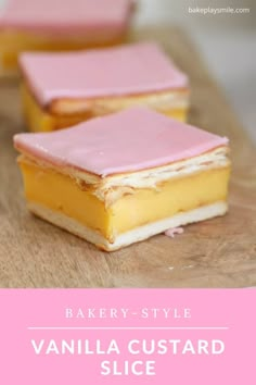 three square desserts sitting on top of a wooden cutting board next to each other