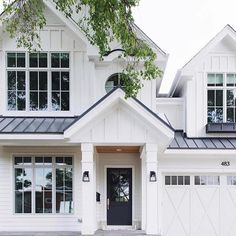 a white house with black trim and windows