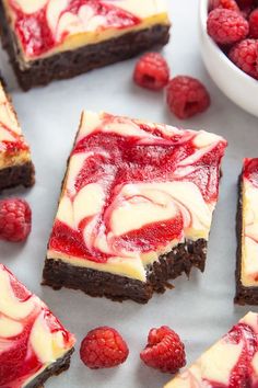 raspberry swirl brownies with white chocolate frosting and fresh raspberries