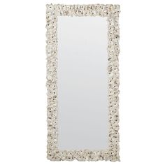 a white framed mirror with shells on it