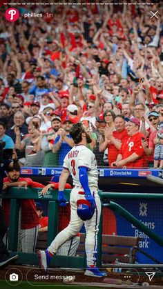 the baseball players are celebrating their team's victory in front of an enthusiastic crowd