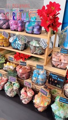 there are many different items on display at this market stall, including yarn and poinsettis