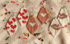 three pairs of beaded earrings with hearts on them