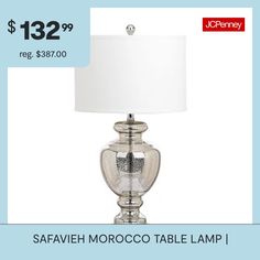 a table lamp with a price tag for $ 32 99 reg $ 38 80 00