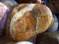 several rocks with different patterns and colors on them