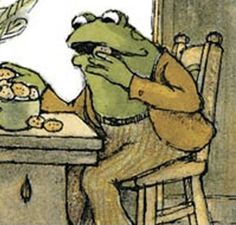 a frog sitting at a table with food in front of him