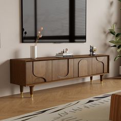 a living room scene with focus on the sideboard and large window in the background