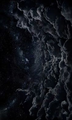 the night sky is filled with clouds and stars, as if they were floating in space