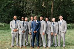 a group of men in suits standing next to each other