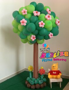 balloon tree with winnie the pooh sitting under it