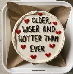 a birthday cake with the words older, wise and hotter than ever on it