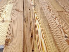 a close up view of the top of a table with wood planks on it