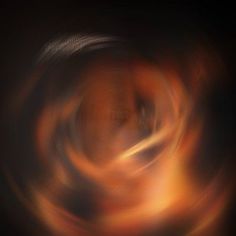 blurry photograph of an orange and black object