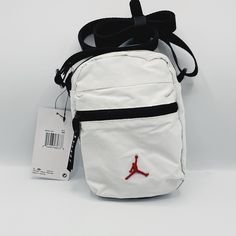 Jordan Airborne Festival Bag Crossbody White Jumpman Fanny Pack White Rectangular Chest Bag For School, White Chest Bag With Mobile Phone Pocket For School, Everyday White Chest Bag Pouch, Functional White Bags For Daily Use, White Crossbody Chest Bag For School, White Pouch Chest Bag For Everyday Use, White Casual Chest Bag With Adjustable Strap, Everyday White Pouch Chest Bag, Casual White Pouch Chest Bag