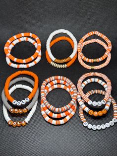 TN Vols game day accessories! Stack options can be any bracelet or bracelets you wish in the quantity you order.  colors may vary amongst different screens Cheap Sporty Stretch Bracelet For Game Day, Tennessee Vols Jewelry, Tennessee Clay Bead Bracelets, Easy Braclets Ideas, Tennessee Vols Bracelet, Fall Clay Beaded Bracelets, Clay Bead Bracelets Ideas Fall, Fall Themed Clay Bead Bracelets