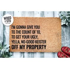 a door mat that says i'm gona give you to the count of 10 to get your ugly vella, no - good kester off my property