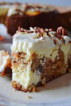 a piece of cake sitting on top of a white plate next to another slice of cake