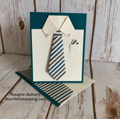 a close up of a card with a tie on it